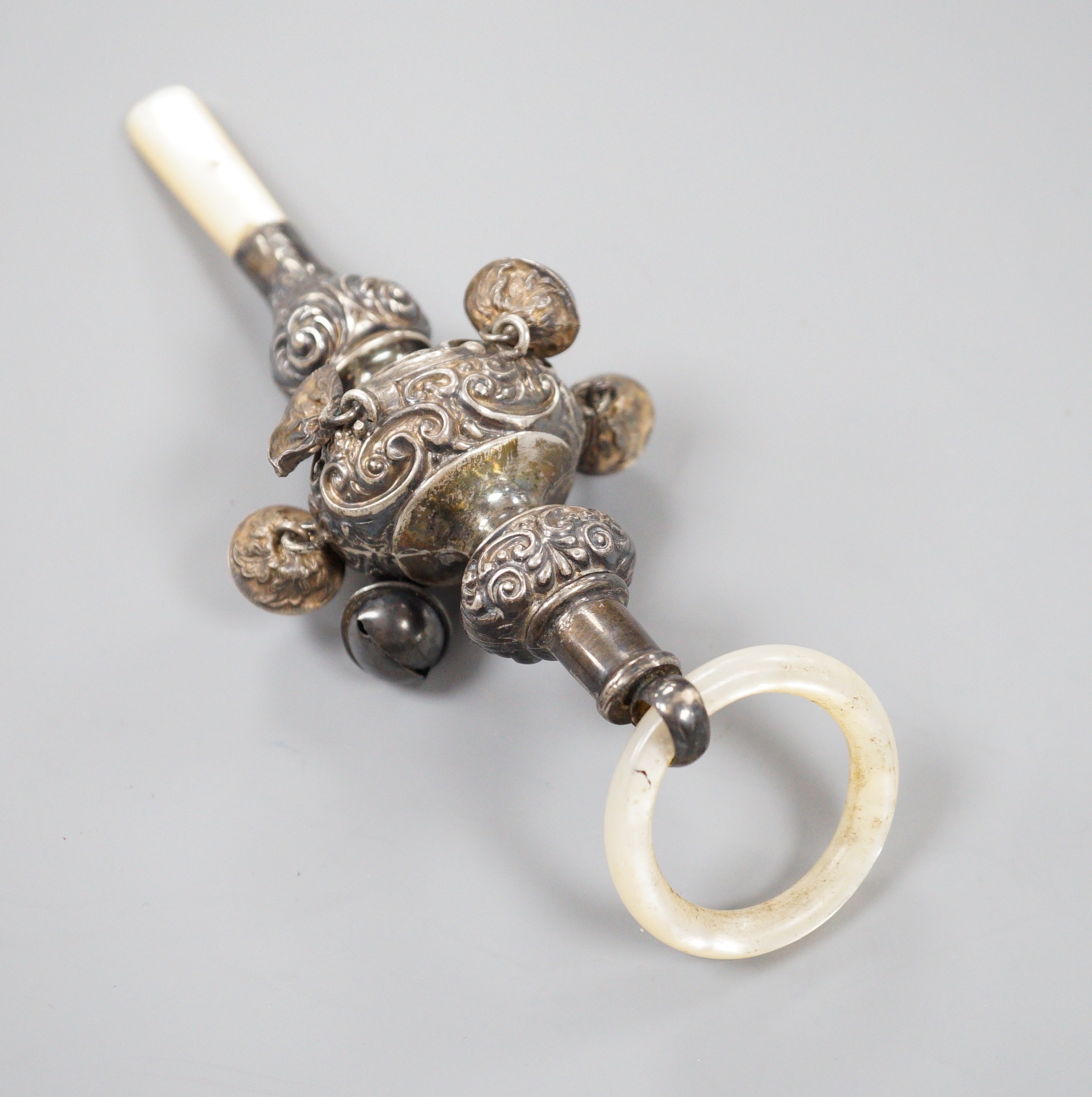 An Edwardian silver and mother of pearl mounted child's rattle, Birmingham, 1904, 16.2cm.